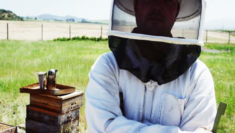 Confident-beekeeper-standing-with-arms-crossed