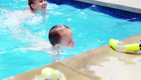 Sibling-enjoying-in-swimming-pool