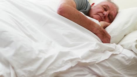 Senior-man-sleeping-in-the-bedroom