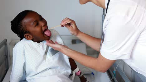Female-doctor-examining-a-sick-girl