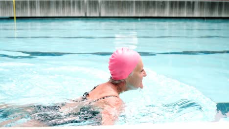 Senior-woman-swimming-in-pool