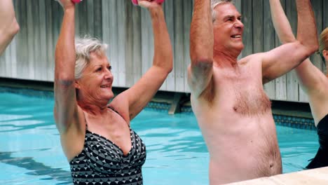 Seniors-performing-exercise-in-swimming-pool