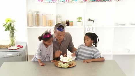 Ethnic-dad-and-children-celebrating-a-birthday