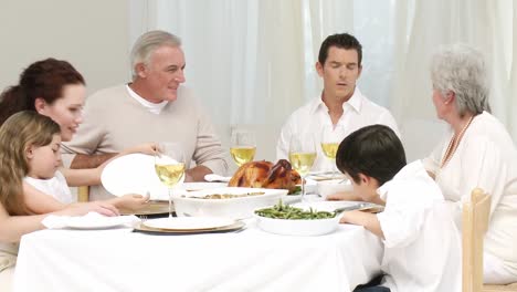 Family-talking-at-their-Christmas-dinner