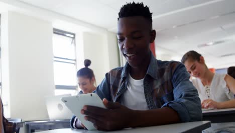High-school-students-using-digital-tablet-in-classroom