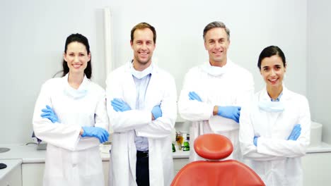 Smiling-dentists-standing-with-arms-crossed