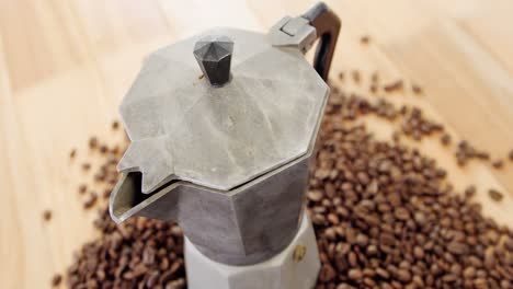 Coffee-beans-with-metallic-coffeemaker