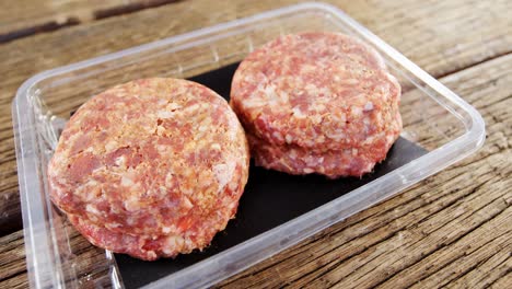 Meat-patty-in-plastic-container