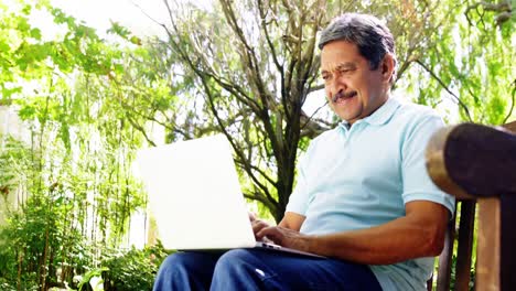 Senior-man-using-laptop