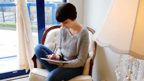 Woman-using-digital-tablet