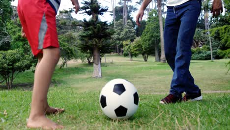 Father-and-son-playing-football