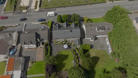 Aerial-dolly-featuring-old-and-new-architecture-in-Claremorris,-County-Mayo
