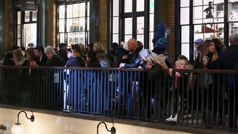 People-celebrating-within-Covent-Garden-before-Christmas,-London,-United-Kingdom