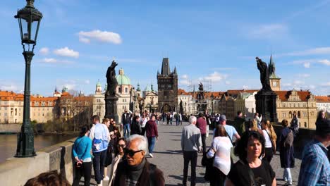 Tourists-visiting-the-Charles-Bridge-in-Prague,-Czech-Republic