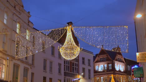 Low-angle-shot-of-Christmas-lights-setup-over-the-street,-in-the-heart-of-Dublin-Dublin,-Ireland-during-evening-time