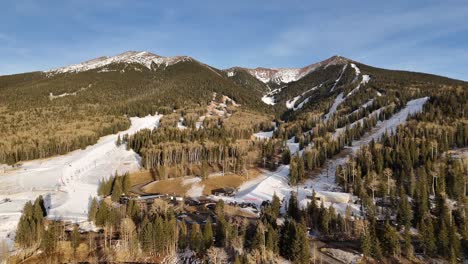 Aerial-View-of-Mountains-Partially-Covered-in-Snow