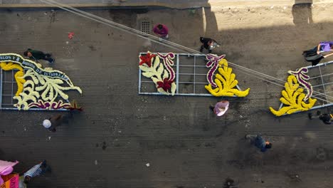 Flyover-truck-right-of-floral-arrangements-at-the-Day-of-the-Dead-festival-in-Iztapalapa,-CDMX,-Mexico---public-wiring