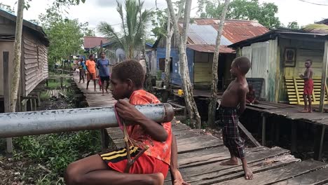 sweet-smiles-of-Papuan-children-with-local-culture-and-wisdom-in-Papua,-Indonesia