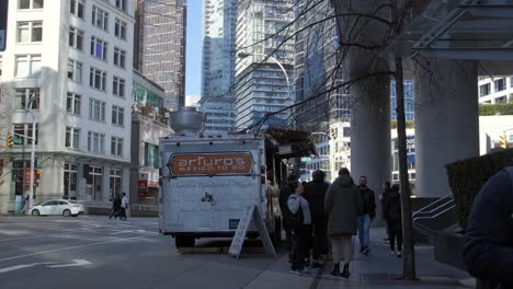 Individuals-Queuing-up-at-the-Food-Truck-on-the-Streets-of-Vancouver,-British-Columbia,-Canada---Medium-Shot