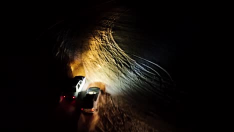 Dark-night-winter-drift-racing-competition-on-snowy-agricultural-field