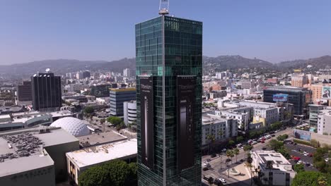 Sunset-Vine-Tower-apartments-in-Hollywood,-California---pullback-aerial