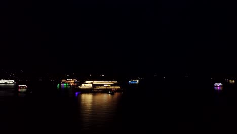 Drone-shot-over-a-boat-in-the-sea-during-the-night,-Goa,-India