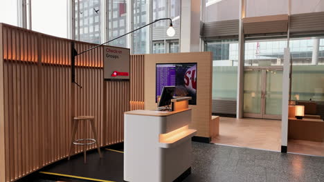 Group-Checkin-at-the-Airport-with-a-nice-wooden-style-counter