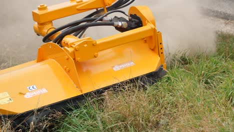 Verge-mowing-arm-cutting-the-grass-on-the-road-shoulder