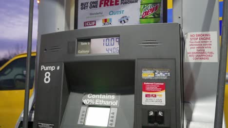 Detail-shots-of-filling-up-with-gas-at-a-rural-gas-station-in-the-early-morning-light