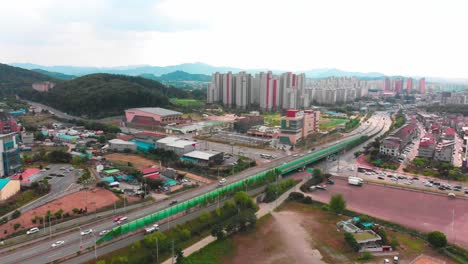 Aerial-tripod-towards-city-and-highway-bridge-intersection