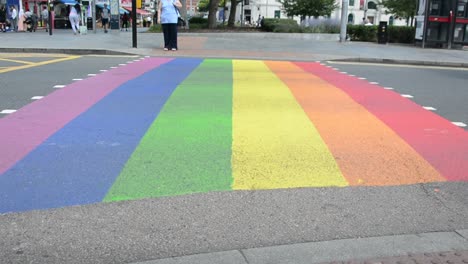 Rainbow-street-pedestrian-crossing-at-intersection-in-London-for-gay-pride,-pride-month,-low-angle-shot,-static-camera,-day-,real-time