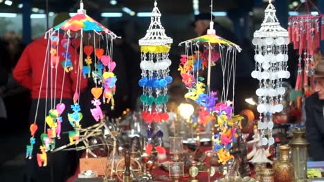 Wind-medals-and-bells-in-the-flea-market-slow-motion