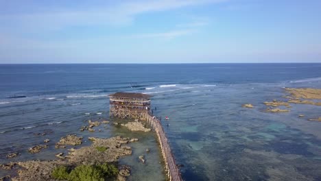 High-quality-4k-Drone-shot-of-a-famous-boardwalk-in-the-island-of-Siargao-in-the-Philippines-with-clear-skies-and-Crystal-blue-waters