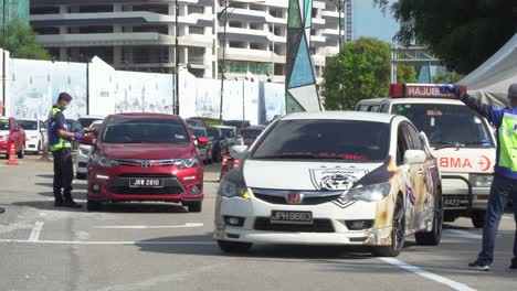 Police-Officer-Directing-Traffic-at-Covid-19-Road-Block-Checkpoint