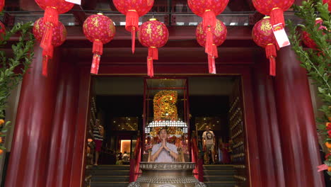 A-man-placing-a-Joss-stick-and-praying-to-the-heavens-for-a-prosperous-Chinese-new-year