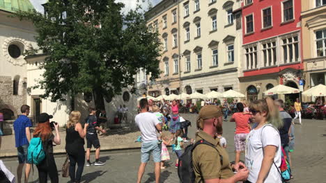 Street-performer-in-Krawkow,-Poland-with-bubbles