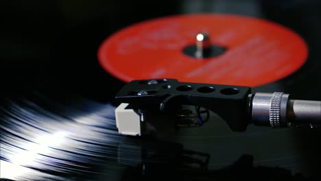 Closeup-needle-on-spinning-vintage-vinyl-record-on-turntable