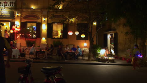 A-tracking-shot-of-a-walking-street-vendor-selling-toys-with-blinking-LED-lights-for-children