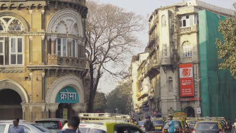 Bank-of-Baroda-Branch,-the-largest-Public-Sector-Bank-of-India-and-financial-services-statutory-body-hoarding-with-logo-outside-building-opposite-to-Chroma-in-Horniman-Circle,-India