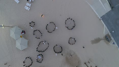 Aerial-Drone-Shot-above-Group-Of-People-training-and-Running