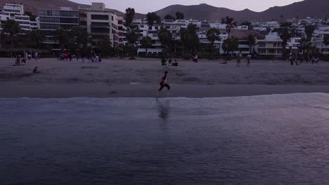 Kid-playing-in-the-coastal-beach-of-Lima-Coasta-Verde