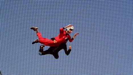 Two-men-fly-in-the-air-tunnel-at-the-aviation-technology-exhibition-in-Istanbul