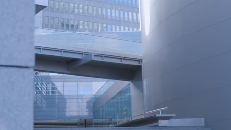 Zooming-Out-Shot-Of-Walkway-Between-Two-Buildings-In-Downtown-Gdynia