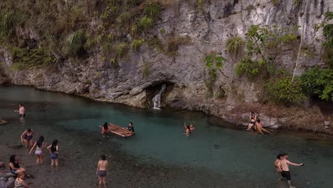 Group-of-tourist-swimming,-relaxing-and-enjoying-of-blue-waters-in-Pozuzo,-Peru