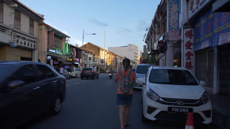 People-Walking-Down-Street-in-Malaysia,-Tourists,-Busy,-Wide-Angel,-Late-Afternoon