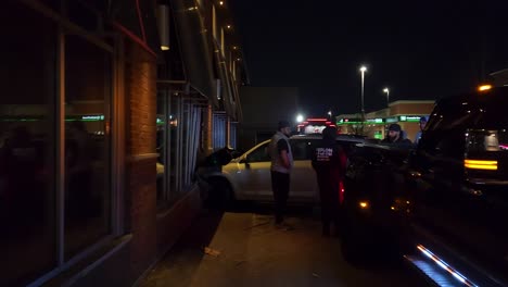 Tow-truck-preparing-to-remove-crashed-Toyota-from-shopfront