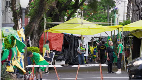 Supporters-of-the-Brazilian-ex-president-Jair-Bolsonaro-camp-in-front-of-the-Army-Head-Quarters-of-Porto-Alegre,-Brazil,-in-protest-asking-for-federal-intervention-after-Lula's-presidential-election