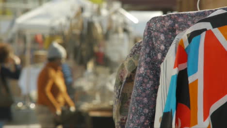 Brooklyn-Flea-Market-in-the-summertime-with-shoppers-walking-around,-deep-focus-shot