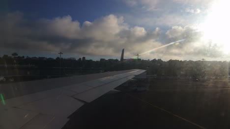 Airplane-taxing-in-João-Paulo's-II-airport-in-the-city-of-Ponta-Delgada-in-São-Migel's-island-in-the-Azores-in-the-morning-with-the-sun-on-the-backlight