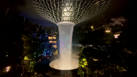 Slow-motion:-Tropical-indoor-vegetation-sorrounding-tallest-indoor-waterfall-at-Singapore-airport